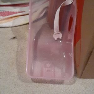 A baby doll car seat